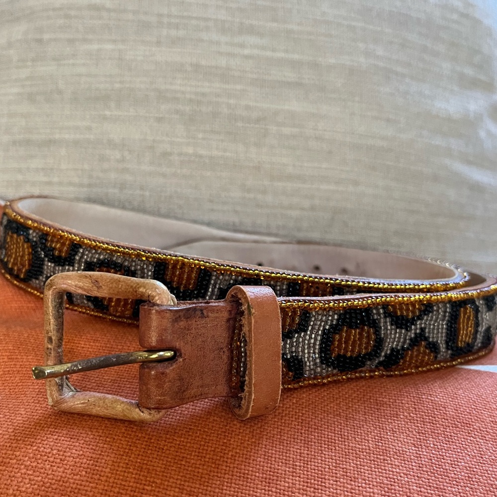 Beautiful handcrafted beaded belt in rich black, brown/gold and beige colors.